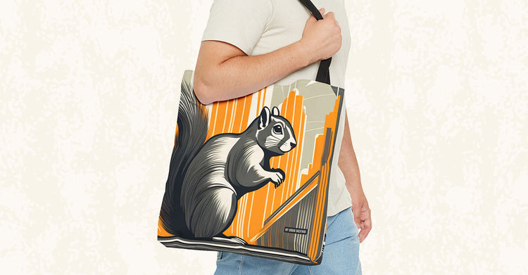 Green-shirted woman carrying a tote bag with a large illustrated cat and blue flowers at a market.